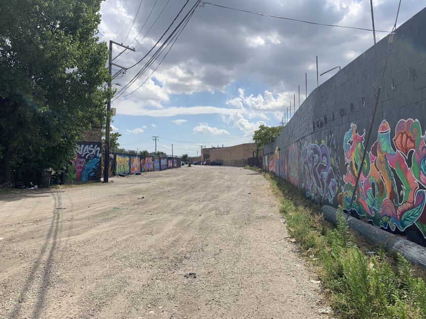 An array of murals snakes through unpaved alleys in the shadow of the Cook County Jail.