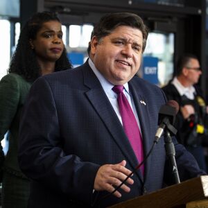 Cook County State’s Attorney Kim Foxx looks on as Gov. J.B. Pritzker speaks during a press conference at the Leighton Criminal Courthouse after Foxx filed motions to vacate more than 1,000 low-level cannabis convictions, Wednesday afternoon, Dec. 11, 2019.