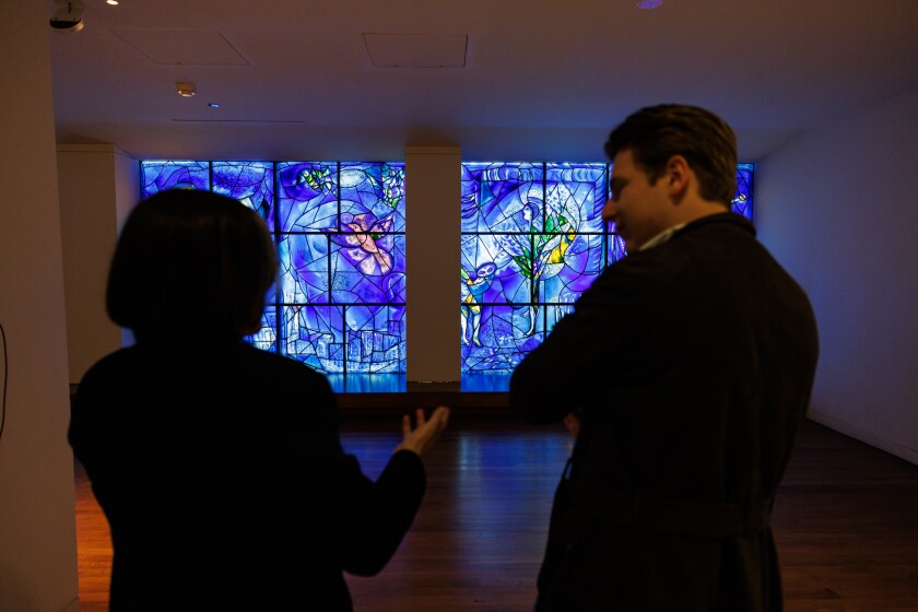 Rebecca J. Long, Patrick G. and Shirley W. Ryan Curator, (left) and Klaus Makela, Music Director of the CSO, speak about the “America Window” by Marc Chegall at the Art Institute of Chicago, Tuesday, Feb. 17, 2026.