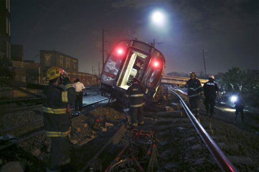<small><strong>Emergency workers at the scene of the Amtrak derailment Tuesday night in Philadelphia. | Joseph Kaczmarek/AP</strong></small>