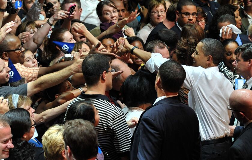 President Barack Obama shakes hands with supporters during a birthday fundraiser on August 3, 2011 at the Aragon Ballroom.