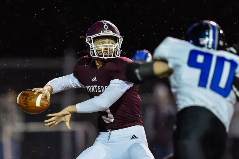 Lockport’s Brady Pfeiffer (9) looks for an open receiver during the game against Lincoln-Way East.