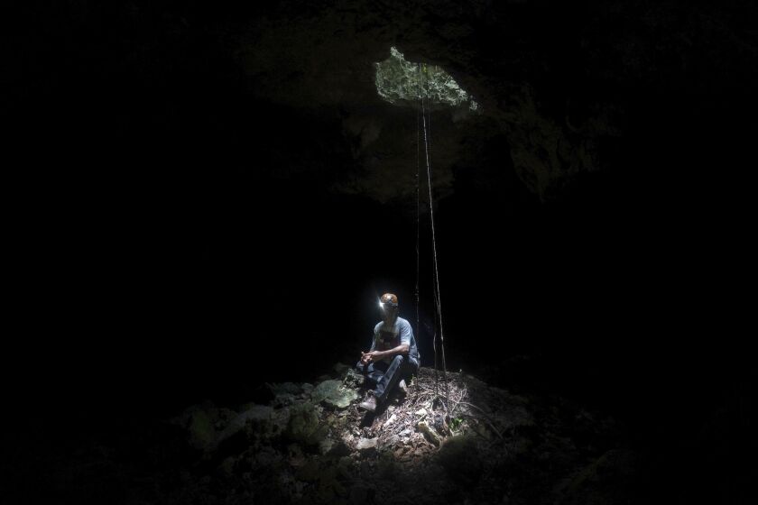 Raul Padilla, member of the Jaguar Wildlife Center which works to protect jaguars, inside a miles-long cave system known as “Garra de Jaguar,” or The Paw of the Jaguar,” underneath the planned route of the Maya Train in Playa del Carmen , Quintana Roo state, Mexico.