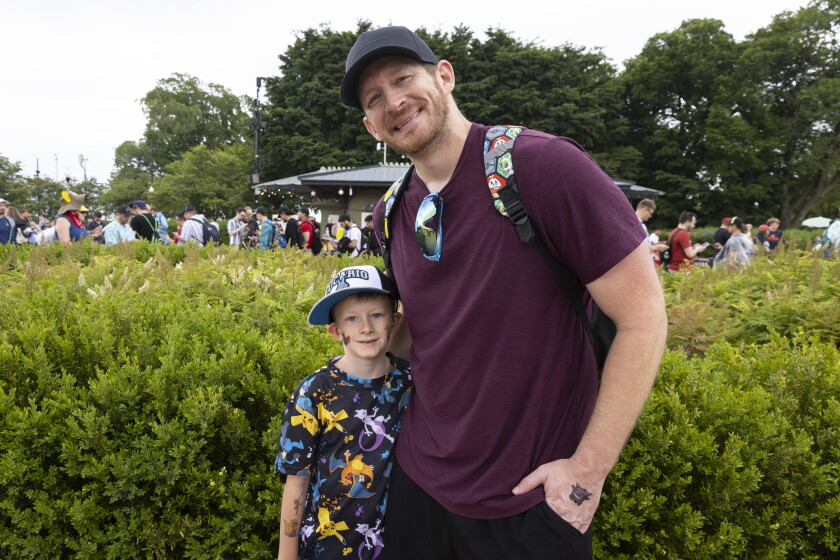 Taylor Wesley and his 7-year-old son, Landry, attend Pokémon Go Fest in Chicago on Friday.