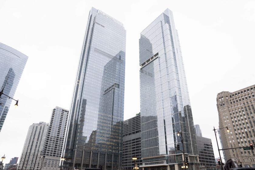 Salesforce Tower Chicago, at left, looks mirror-shiny on a cloudy day.