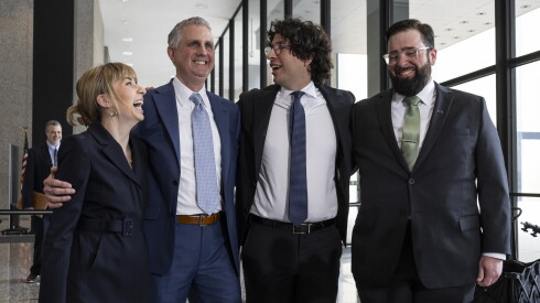 The remaining four members of the so-called “Broadview Six": Kat Abughazaleh (from left), Michael Rabbitt, Andre Martin and Brian Straw stand together after their case was dropped during a hearing at the Dirksen Federal Courthouse, Thursday, May 21, 2026. | Ashlee Rezin/Sun-Times