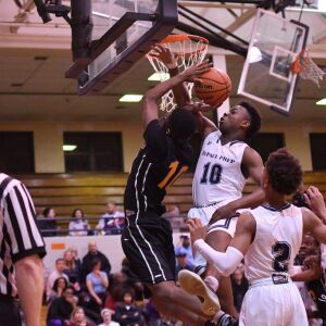 DePaul Prep’s Raheem Anthony fouls St. Mel’s Jason Mason (10). Worsom Robinson/For the Sun-Times.