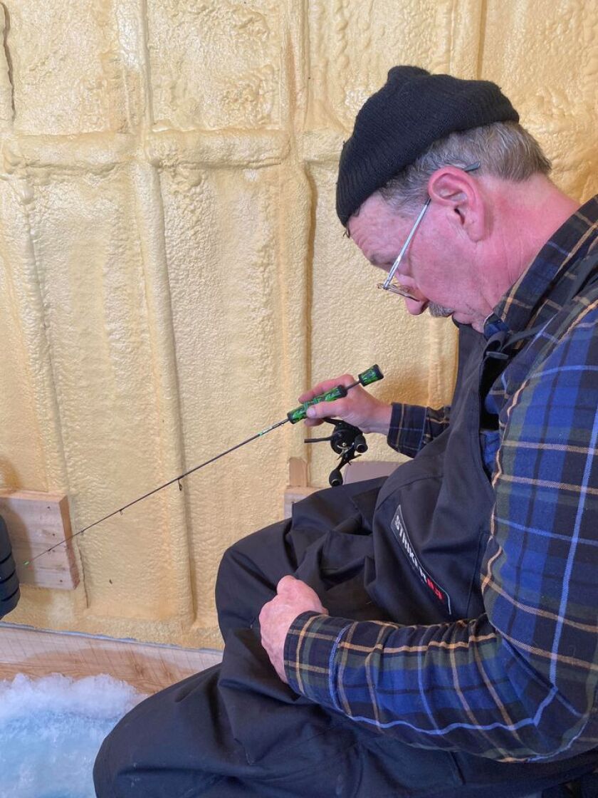 John Jakiel ice fishing on Sturgeon Bay on an outing with his son Jeremy. Provided photo