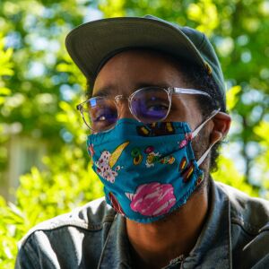 Jean Luc Williams, 30, of Humboldt Park, wears a mask with ice cream on it. “I immediately saw this one and thought turquoise and bright colors, this is my mask.”