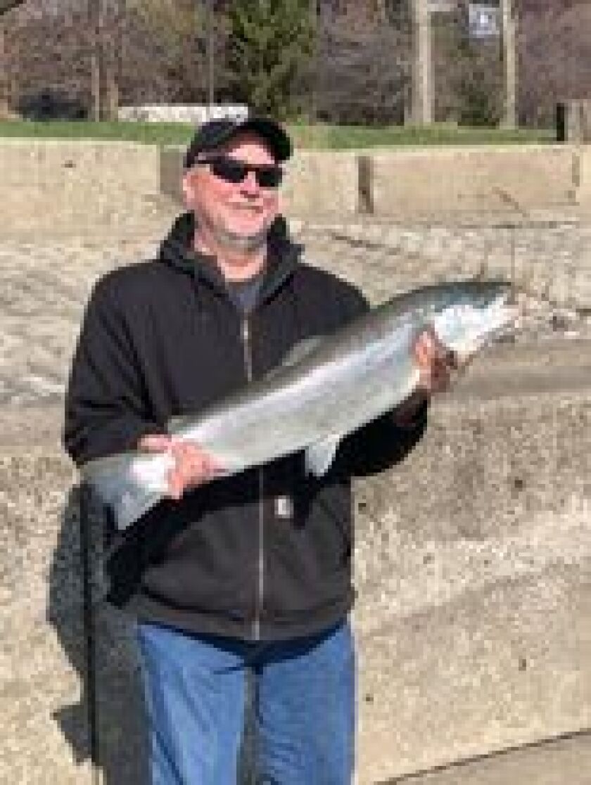 Michael Fogarty with a good brown trout, which are starting to move on the Chicago lakefront. Photo provided by Chris Ranney
