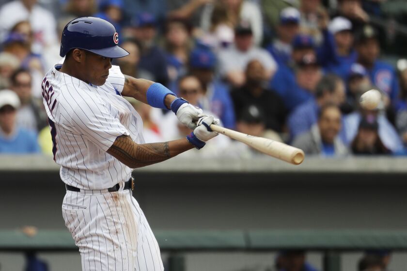 Addison Russell connects on a home run against Lucas Giolito.