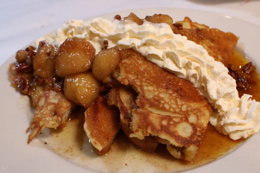 Bananas foster french toast, served at Hidden Manna Cafe, is made with bananas, pecans whipped cream, and maple syrup.