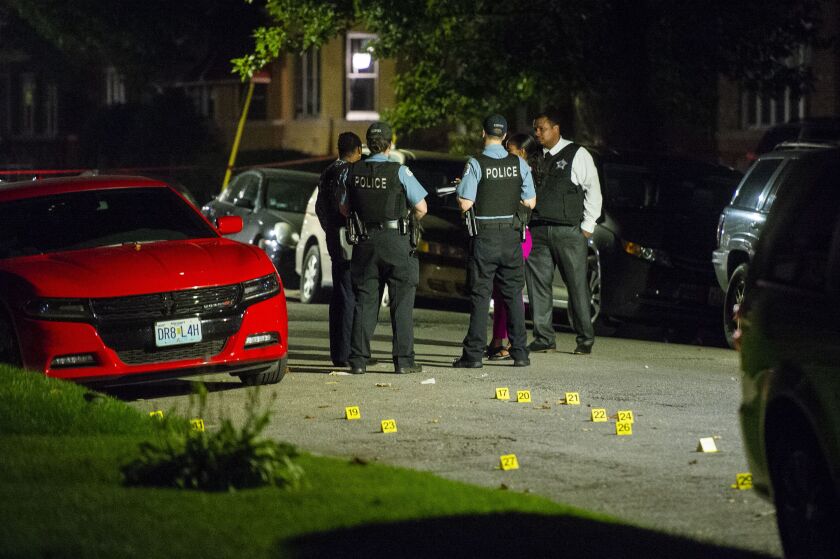 Police investigate a person shot four times Tuesday morning in the 8400 block of South Dante. | Tyler LaRiviere/Sun-Times