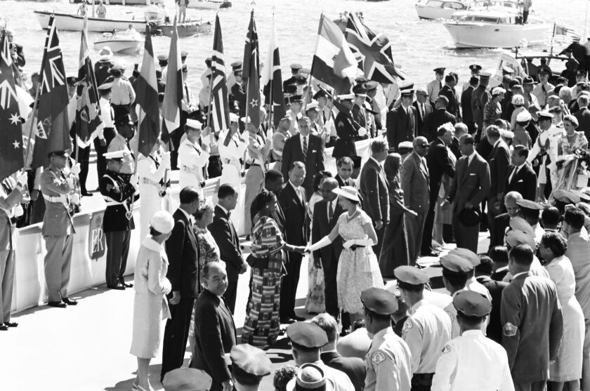 Mayor Richard Daley is among the entourage of dignitaries and troops greeting Queen Elizabeth II and Prince Philip upon their 1959 arrival in Chicago. 