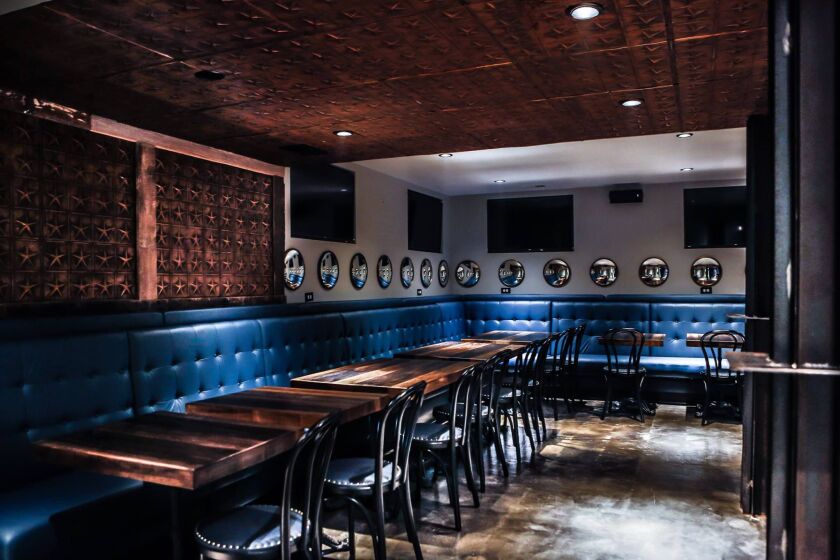 The dining area in “The Hull” basement bar at Ironside Bar & Galley. | FACEBOOK