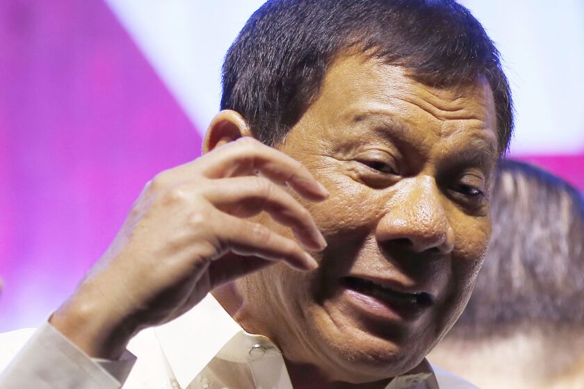Philippine President Rodrigo Duterte addresses thousands of protesters following his state of the nation address in Quezon city, northeast of Manila, Philippines. | Bullit Marquez/Associated Press