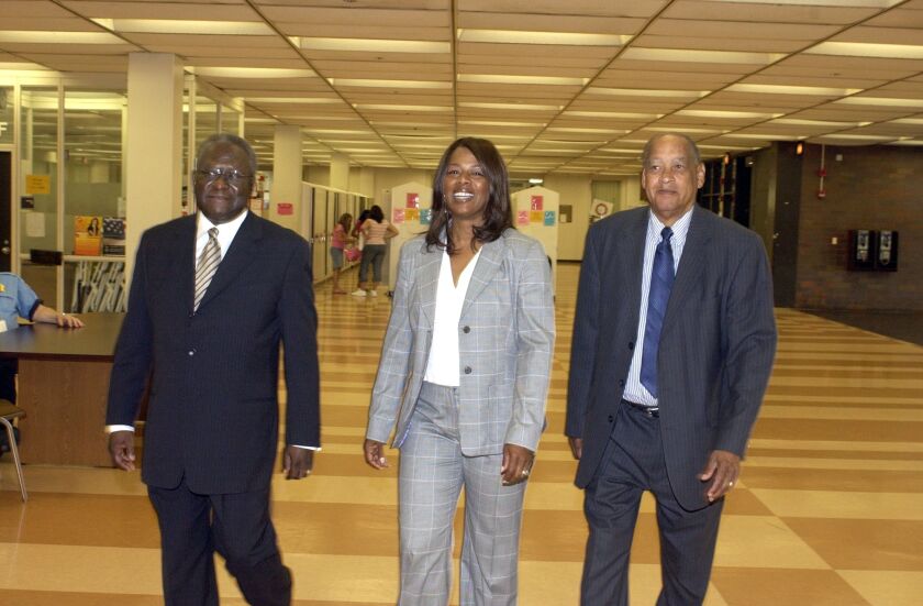 Joyce Kenner walks with the only other two principals in Whitney Young Magnet High School history. The trio attened the “Founding Teachers Breakfast” in June 2005 for the school’s 30th anniversary. From left to right: Powhatan Collins, the second principal of Whitney Young; Kenner, the third principal; and Benarr Dawson, the first principal. 