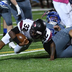 Perspectives’ Elijah Lewis (32) tries to stay on his feet. Worsom Robinson/For the Sun-Times.