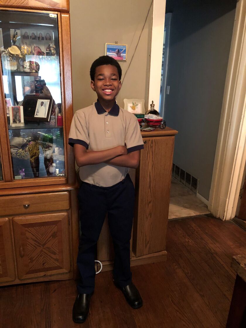 Cordell Brown and 17 other eighth-graders at St. Catherine-St. Lucy School placed third of 64 teams that competed in the Big Shoulders Fund’s annual stock market program.