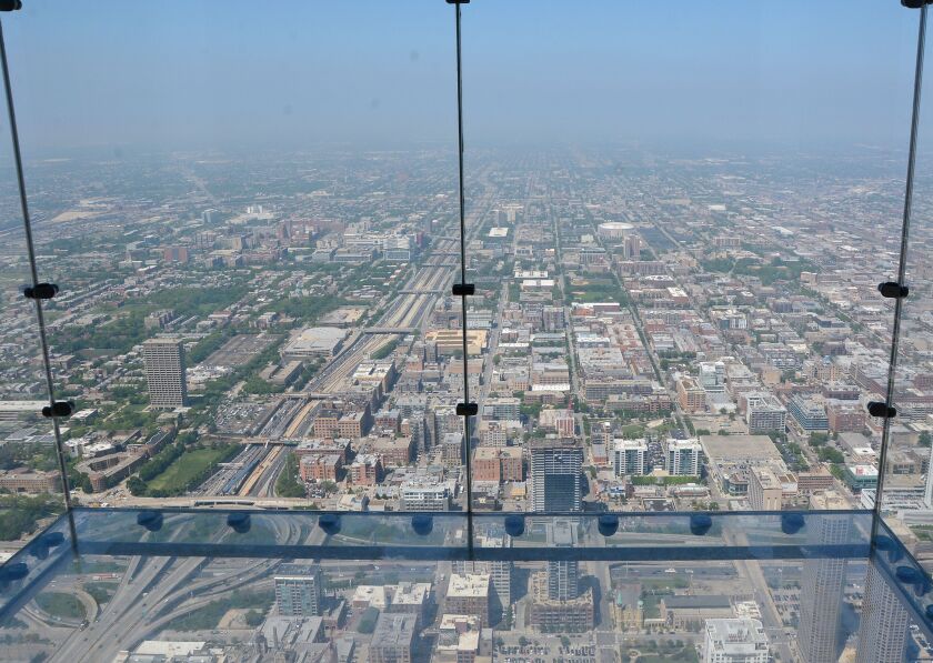 The Willis Tower Skydeck has added glass-floored observation ledges that jut out from the building, allowing visitors to look straight down. | Sun-Times