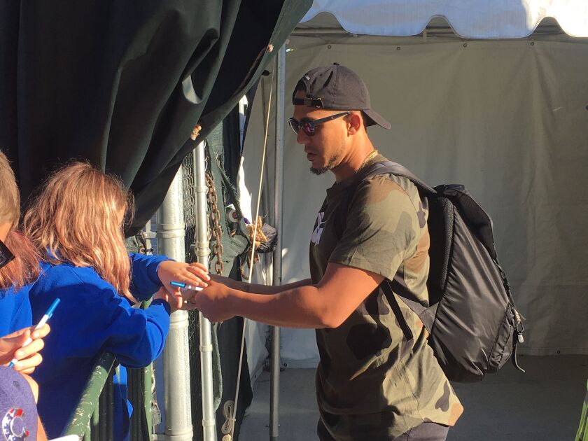 Cubs outfielder Jon Jay signs autographs outside Wrigley Field Monday morning. | Mitch Dudek/Sun-Times