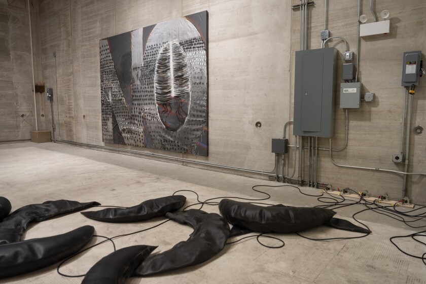 Wendy Jacob’s “Untitled,” which features rubber that inflates, and Molly Zuckerman-Hartung’s “Notley,” a painting made of latex house paint, enamel and spray paint, are on display as part of “Over My Head: Encounters with Conceptual Art in a Flyover City, 1984–2015” at 400 N. Peoria St. in West Town, Saturday, Sept. 20, 2025.