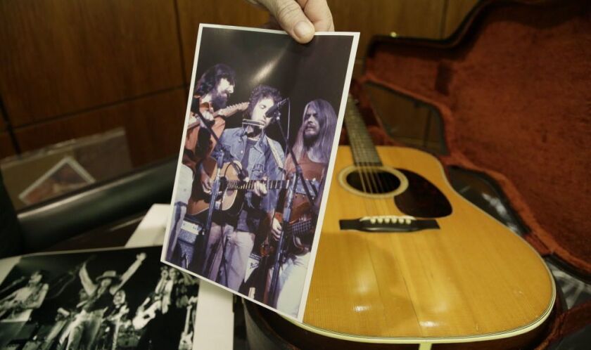 This Friday, Oct. 13, 2017, photo, shows an acoustic guitar that belonged to Bob Dylan. Heritage Auctions said the 1963 Martin D-28 acoustic guitar will be offered up at auction next month. | AP Photo/LM Otero