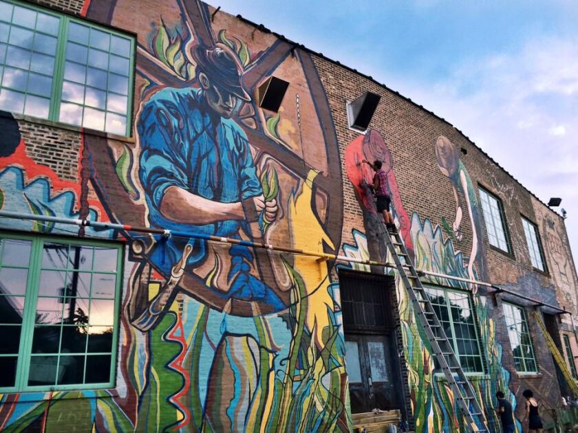 Joe Miller’s mural at 1400 W. 46th St. spans a 3,000-square-foot brick wall.