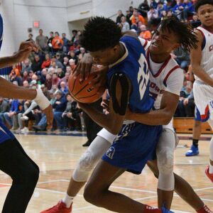 Bloom’s Kevin Vance (22) and Curie’s Ramean Hinton (23) battle for a rebound, Saturday 12-29-18. Worsom Robinson/For Sun-Times