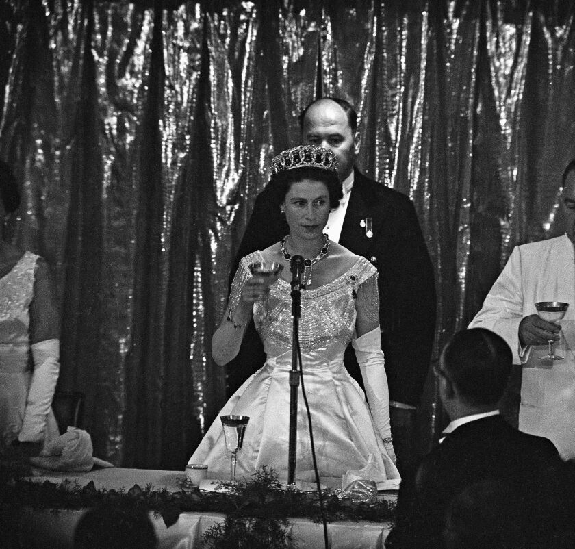 After a busy day in Chicago, Britain’s Queen Elizabeth II offers toast during dinner given by Mayor Richard Daley at Hilton Hotel, July 6, 1959 at the Conrad Hilton Hotel. The reception for the Queen was termed “the greatest she has ever experienced outside Britain.” 