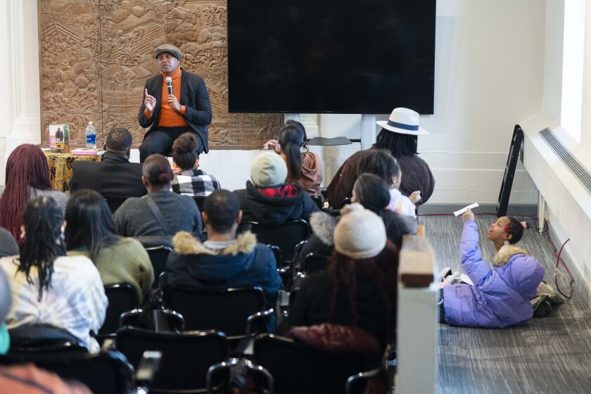 Writer Kevin Powell speaks during a talk to commemorate Martin Luther King Jr.’s life at The DuSable Black History Museum and Education Center, Saturday, Jan. 13, 2024.