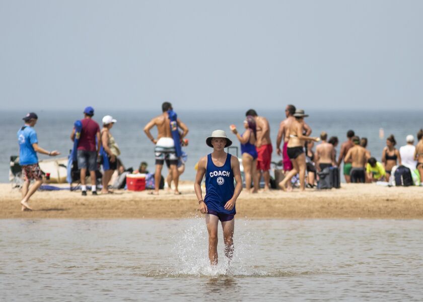People cool off at Montrose Beach on the North Side during a heat wave, Friday afternoon, July 19, 2019.