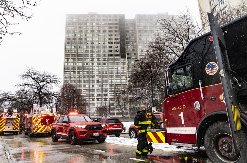 Chicago Fire Department firefighters work to extinguish a fire that broke out in an apartment on the 15th floor and climbed nine floors in a high-rise building in the 4800 block of South Lake Park Avenue in Kenwood on the South Side, Wednesday, Jan. 25, 2023.