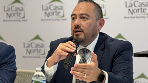 Jose Muñoz, executive director of La Casa Norte, speaks at a launch event for the report.