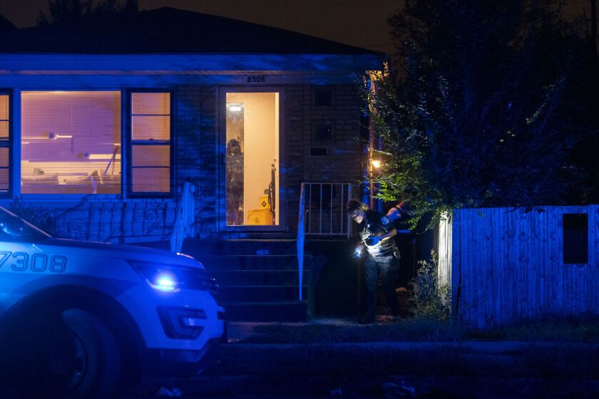 Chicago police work the scene where a 13-year-old boy was shot in the head Saturday evening inside a home in the 8500 block of South Marquette Avenue in South Chicago.