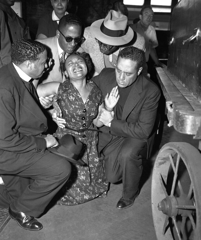 <small><strong>Mamie Till Mobley collapses when her son Emmett’s body arrives at the old Illinois Central Railroad station after his murder by racists in Mississippi. On her left, with the white collar, is Alva Doris Roberts’ husband, Bishop Isaiah L. Rob