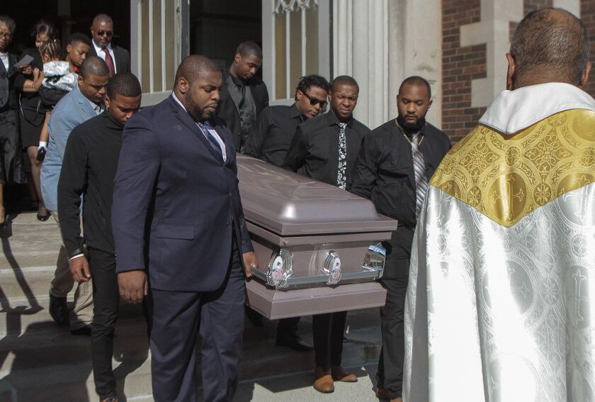 Simone McKay’s casket is carried from St. Margaret of Scotland Church after her funeral Saturday. | Leslie Adkins/For the Sun-Times