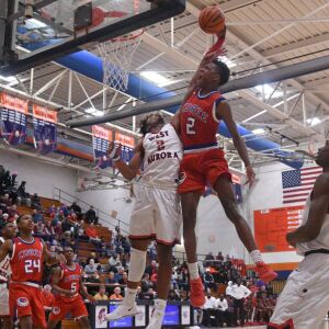 West Aurora’s Cam Donatlan (2) fouls Curie’s DaJuan Gordon (2) at the Pontiac Holiday Tournament, Friday 12-29-17. Worsom Robinson/For the Sun-Times.