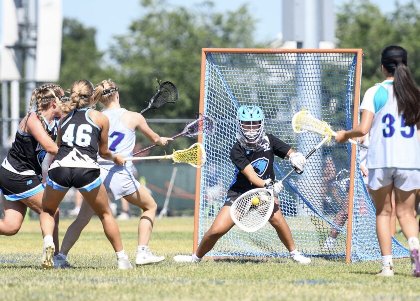 Ruby Shuster plays goal at a tournament in San Jose, California, in equipment borrowed after her luggage was lost at O’Hare Airport.
