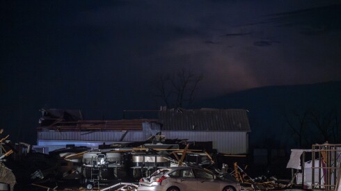 A damaged car lay among the wreckage of a tornado that touched down near Kankakee Tuesday, March 10, 2026.