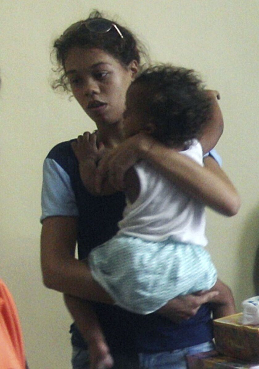 Heather Mack pictured holding her 2-year-old daughter Stella Schaefer in March 2017.