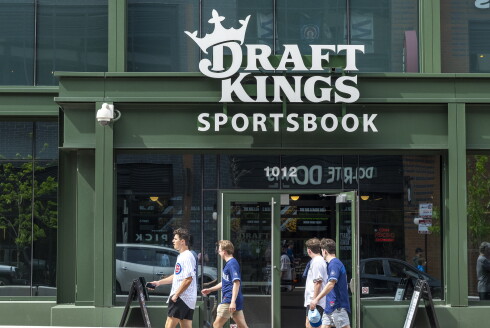 Cubs and Brewers fans walk by the entrance of DraftKings Sportsbook at Wrigley Field, 1012 W. Addison St.
