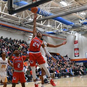 Curie’s Justin Harmon (24) puts in a rebound against Simeon, Saturday 12-29-18. Worsom Robinson/For Sun-Times