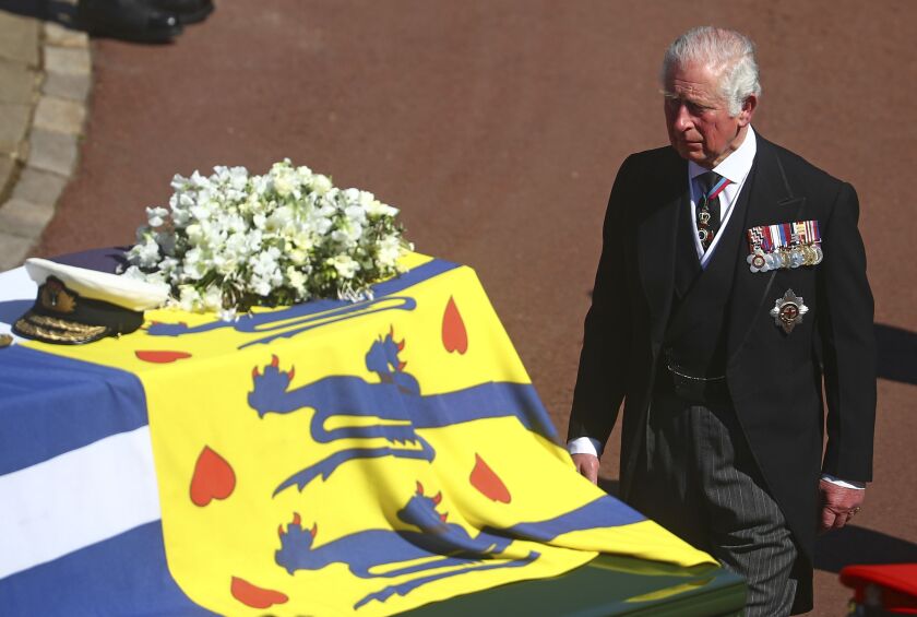 Prince Charles follows the coffin of his father Britain’s Prince Philip during the funeral inside Windsor Castle in Windsor, England, on Saturday, April 17, 2021.