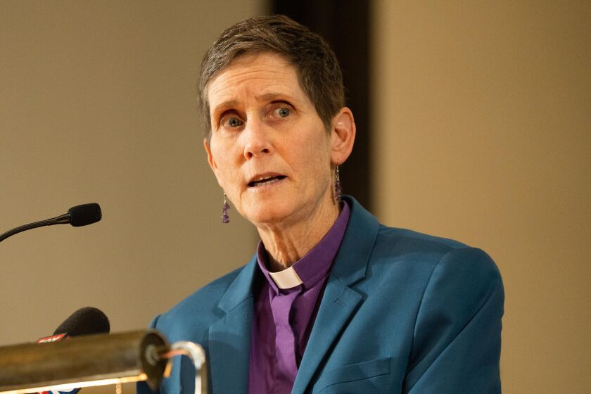 Rev. Beth Brown, pastor of Lincoln Park Presbyterian Church and interim commissioner on the community commission for public safety and accountability, speaks during a press conference at Lincoln Park Presbyterian Church in the Lincoln Park neighborhood, where faith leaders and alderpersons called on other leaders to house asylum seekers who are currently living in police stations, Friday, June 2, 2023. | Pat Nabong/Sun-Times
