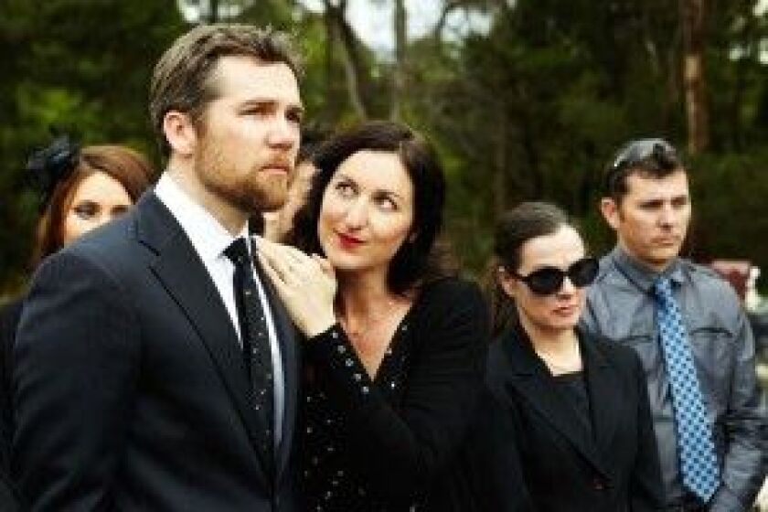 A funeral is overpowering for a woman (Kate Box) turned on by the crying of her husband (Patrick Brammall) in “A Little Death.” | Magnolia Pictures