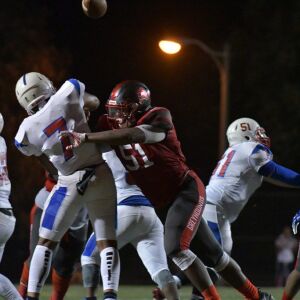 Hubbard’s Kenny Givens (51) sacks Curie’s Damarius Johns. Worsom Robinson/For the Sun-Times.