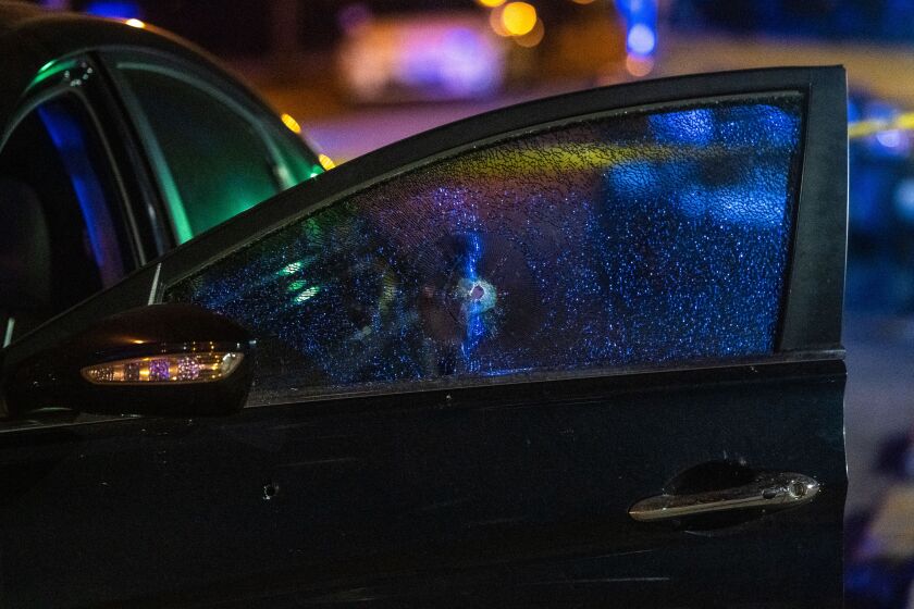 The vehicle that was shot up in a shooting that wounded a man in the face, Friday morning in the 2400 block of North Sacramento, in the Palmer Square neighborhood. | Tyler LaRiviere/Sun-Times