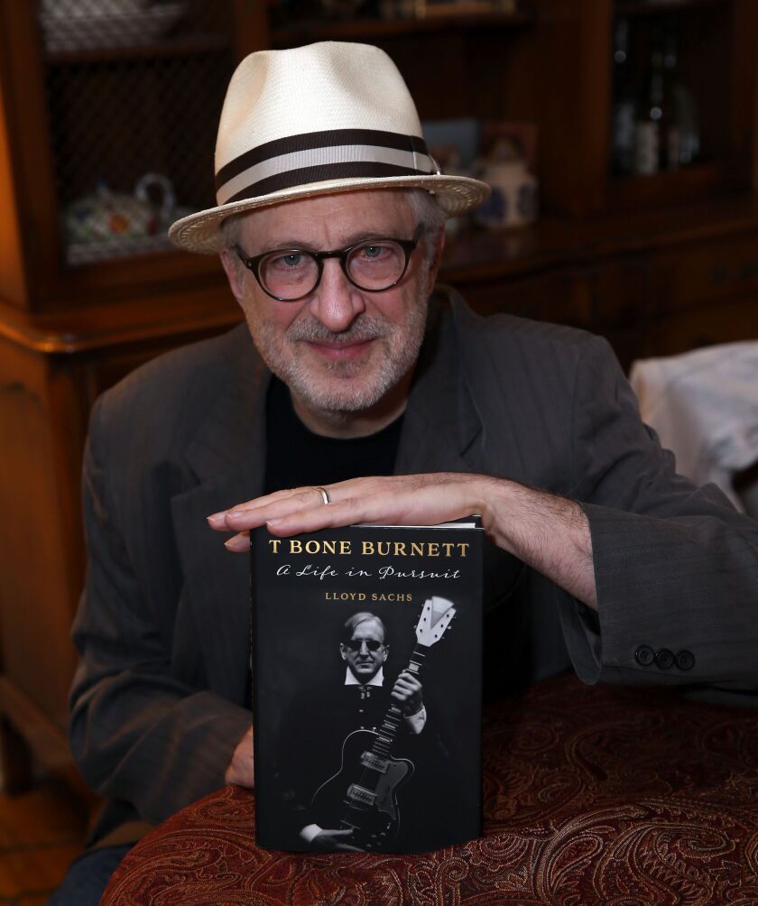 Author Lloyd Sachs and his new book, “A Life in Pursuit” the first book written on T Bone Burnett. | Kevin Tanaka/For the Sun-Times
