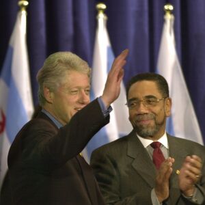 1-9-2001 President Bill Clinton walks onstage and is applauded by Rep. Bobby Rush prior to speaking during a visit to James Ward Elementary School, 2701 S. Shields, Chicago.
